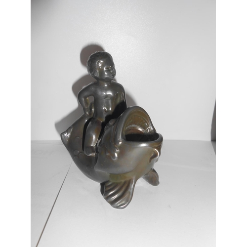 389 - A bronze inkwell in the form of a fish and cupid - 3 3/4in. high, a black pottery inkwell in the for... 