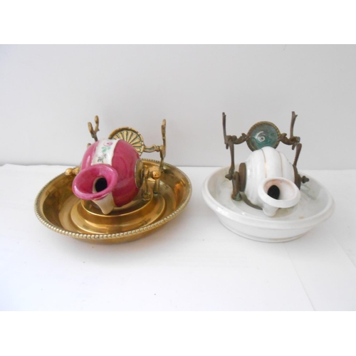 395 - Four French pottery inkwells in the form of revolving shells