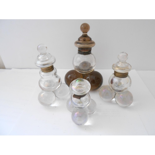 396 - Four glass ball form inkwells - 6in. - 3 1/4in. high