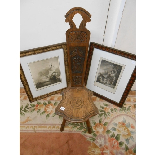 36 - An oak spinning chair with carved decoration and two black and white engravings, mounted, framed and... 