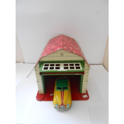 375 - A Louis Marx Magic Garage and Car, boxed - 10 1/2in. long and 8 1/2in. high