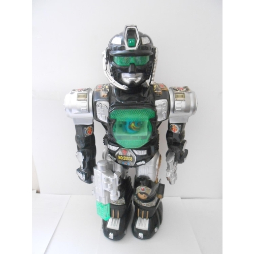 377 - A remote control robot - 14in. high, a battery operated robot - 16in. high and a fabric doll - 22in.... 