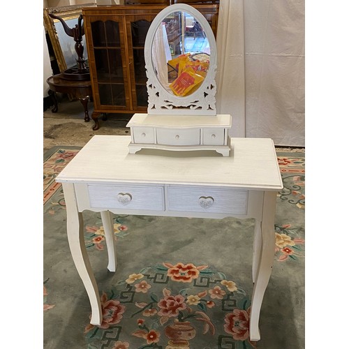 53 - A modern cream painted chest fitted two narrow and two wide drawers, a similar dressing table fitted... 