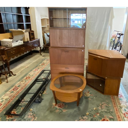 57 - A 1970's teak and glass free standing corner cabinet on black metal legs and a similar coffee table ... 