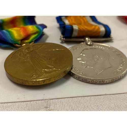 212 - A group of three First World War medals awarded to 10811 Pte F.H Down Dorset R.