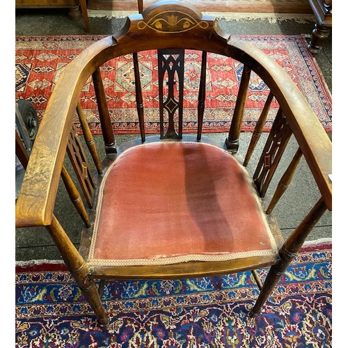 23 - A mahogany duet stool, the seat upholstered in pink dralon and an Edwardian tub chair with inlaid ba... 