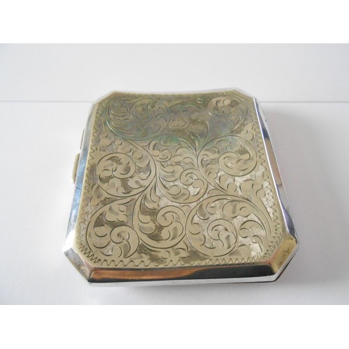 181 - A curved silver cigarette case with engraved leaf scroll decoration - Birmingham 1928, makers marks ... 