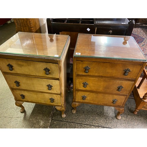 35 - A pair of mahogany bedside chests, each fitted three drawers, on short cabriole legs - 18in. wide