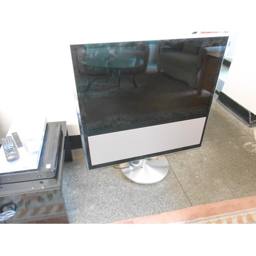 60 - A Bang and Olufsen Beovision 11-40 television with matching motorised floor stand, a Sony DVD player... 