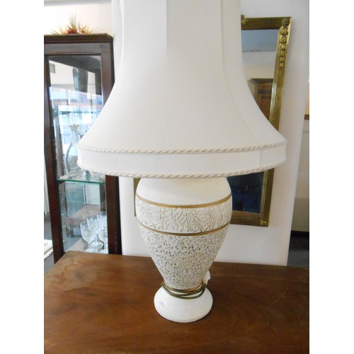 63 - A brass tablelamp base with baluster turned column, a large cream and gold tablelamp base and a smal... 