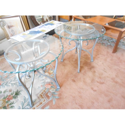 84 - A modern occasional table with crimped edge, inset glass top, on metal base - 30in. dia. and a pair ... 