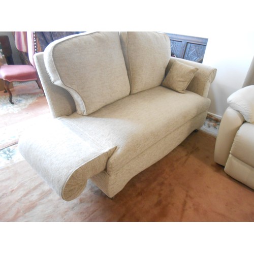 98 - A modern two seater drop arm settee and matching reclining armchair in beige material