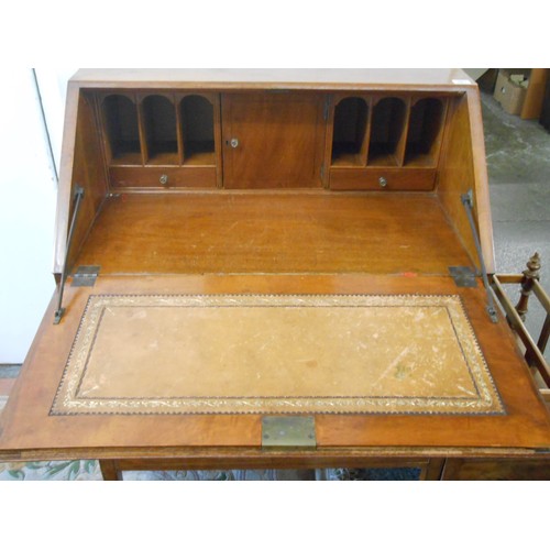 101 - An Edwardian satinwood and mahogany inlaid bureau with hinged fall front above three drawers, on squ... 