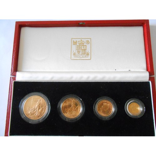 251 - A Royal Mint boxed set of four coins comprising:- 1987 one ounce Britannia, half ounce Britannia, qu... 