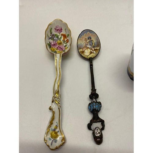 155 - A Continental porcelain spoon painted flowers to the bowl, a Continental enamel spoon decorated with... 