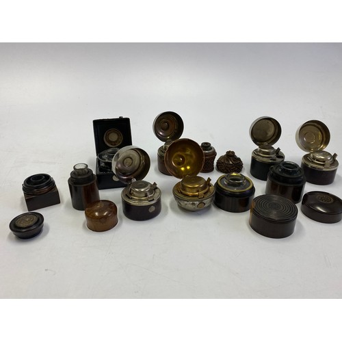 402 - Eleven inkwells including black leather, turned wood, orange etc..