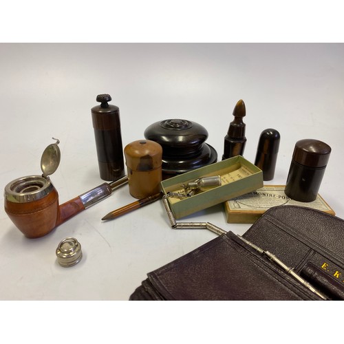 403 - Six turned wood inkwells, a Thomas De La Rue burgundy leather stationery case, Pipe Of Peace writing... 