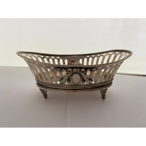 245 - A heavy oval silver bon bon basket with rope twist edge, saw pierced sides with harebell swag and ov... 