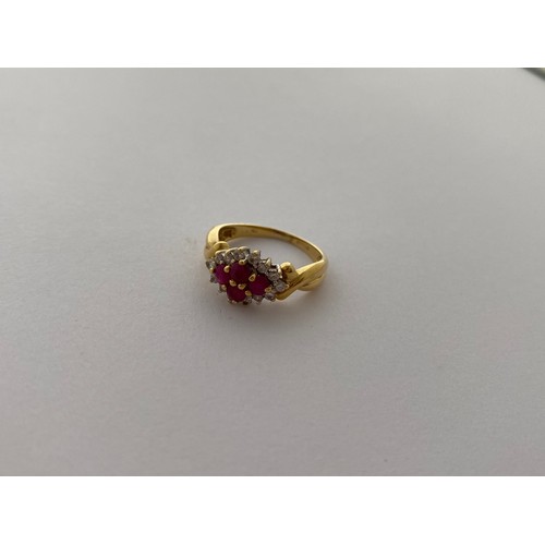 294 - A lady's ring set five rubies surrounded by diamonds, on an 18ct. gold shank and one other lady's ri... 