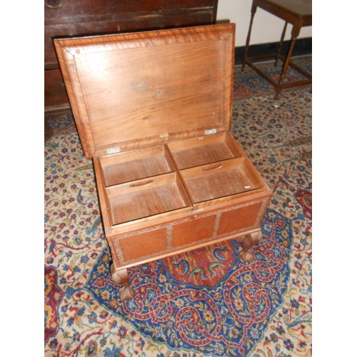 50 - A Kashmir carved walnut sewing box with hinged lid enclosing trays, on cabriole legs