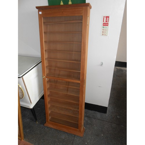 67 - A pair of walnut finished wall cabinets fitted panelled doors enclosing shelves, brass knob handles ... 