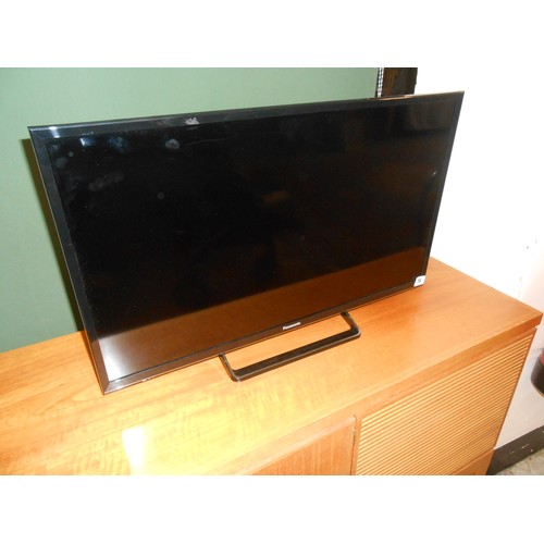 76 - A Panasonic flatscreen television with remote control