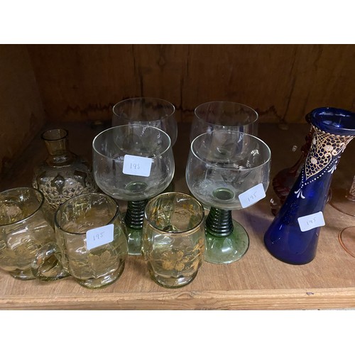 195 - A cranberry decanter, four 'Bristol' blue style vases and a selection of coloured glass