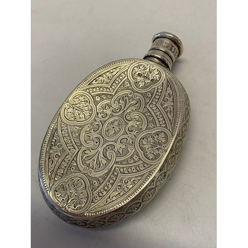 237 - A Victorian silver hip flask of ovoid form with all over engraved decoration, screw cap - Birmingham... 