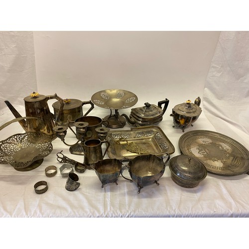 249 - A selection of silver plated items including two three piece tea services, cake baskets, tray, napki... 