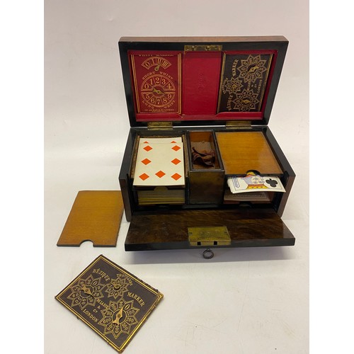 319 - A Victorian walnut card box with brass mounts, the interior fitted to the lid with leather bezique a... 