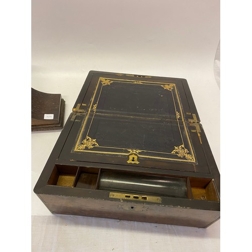 329 - A Victorian writing box, the interior with black and gilt tooled leather writing surface - 13 1/2in.... 