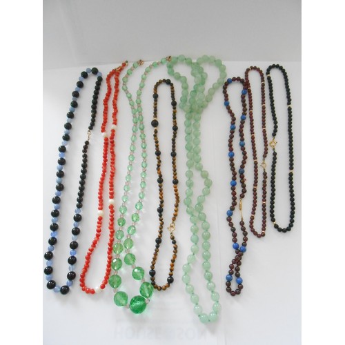 202 - A quantity of bead necklaces with 9ct. gold clasps