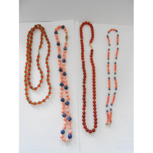 202 - A quantity of bead necklaces with 9ct. gold clasps