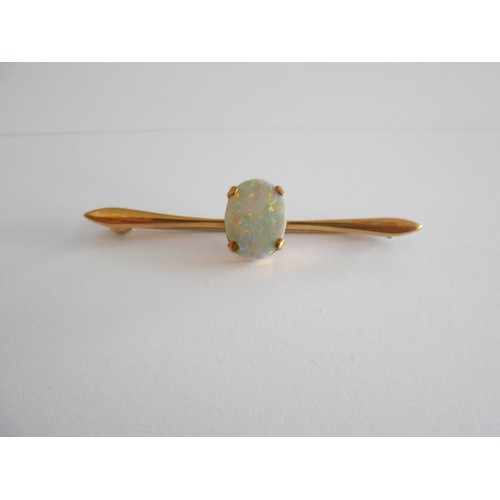 207 - A 9ct. gold bar brooch set opal