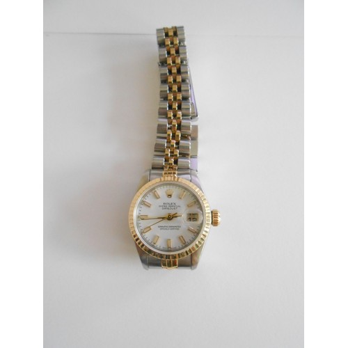 209 - A lady's Rolex Datejust wristwatch with white dial, in a steel and 18ct. gold case, on a steel and 1... 