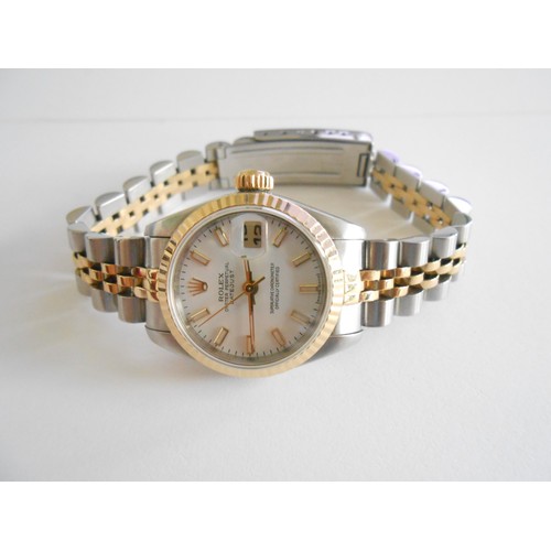 209 - A lady's Rolex Datejust wristwatch with white dial, in a steel and 18ct. gold case, on a steel and 1... 