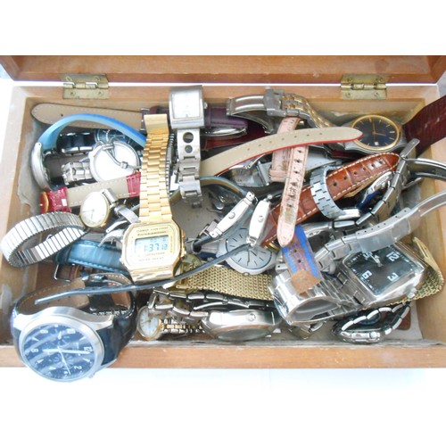 210 - A mahogany box containing a selection of lady's and gentlemen's wristwatches including a gentleman's... 