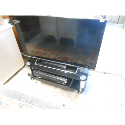 54 - A Panasonic flatscreen television, DVD player, sound bar and DVD/video player