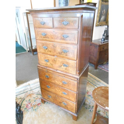 65 - A Georgian design walnut veneered and crossbanded chest on chest fitted two narrow and three wide dr... 