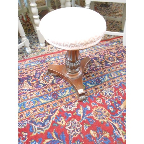 66 - A Victorian rosewood framed piano stool with moulded column, on trefoil base