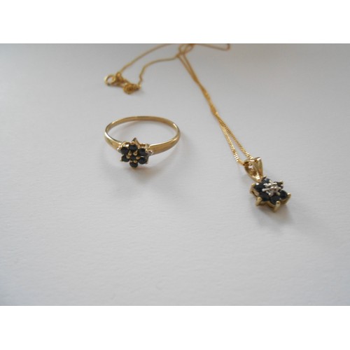 229 - A fine 9ct. gold chain with sapphire and diamond flower form pendant and a similar ring set sapphire... 