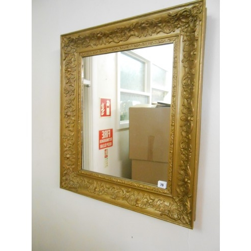 79 - A rectangular wall mirror in a gilt frame with moulded decoration - 29in. x 25in. and one other rect... 