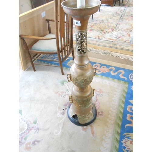 85 - A Chinese style floor standing lamp, on circular black wooden base