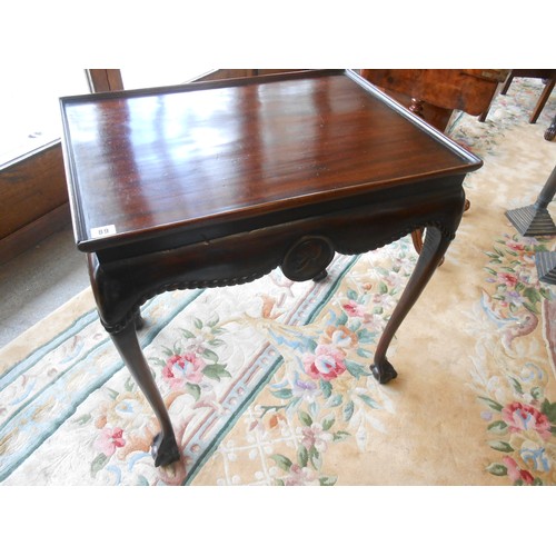 89 - A mahogany silver table with rectangular tray top, rope carved and mask decoration, on cabriole legs... 