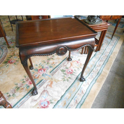 89 - A mahogany silver table with rectangular tray top, rope carved and mask decoration, on cabriole legs... 