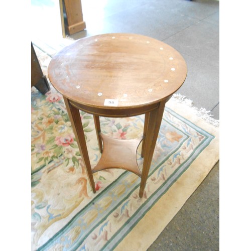 90 - A mahogany occasional table with circular top, inlaid to leaf scrolls and mother of pearl flowers, o... 