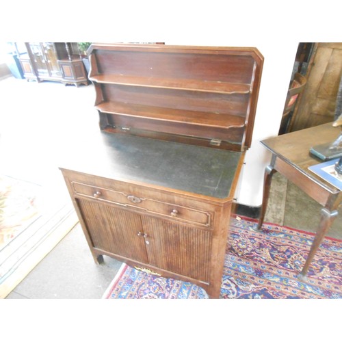 94 - A French mahogany writing table with hinged top enclosing writing surface, candleslides to each end,... 