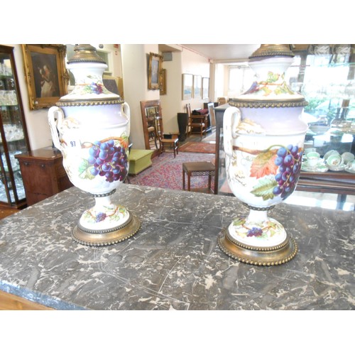 97 - A pair of Continental urn form vases painted grapes, on metal bases, converted to tablelamps - 19in.... 