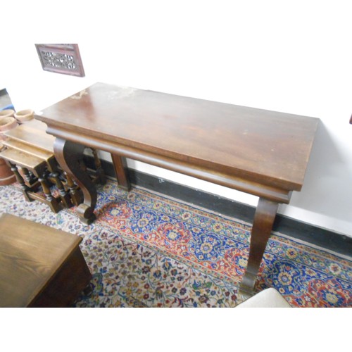 102 - A mahogany console table with rectangular top, on scroll forelegs - 50in. wide