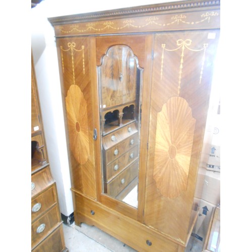 118 - An Edwardian mahogany and satinwood inlaid wardrobe with harebell decoration, fitted centre mirrored... 